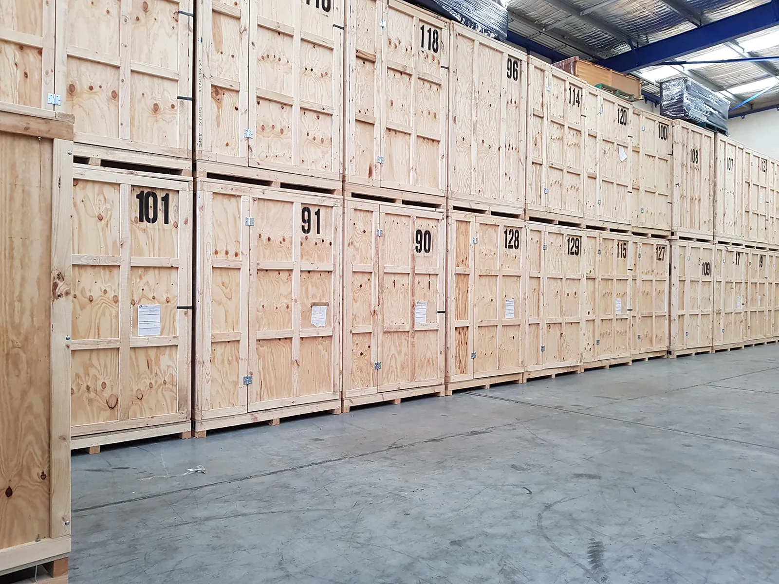 Rows of numbered timber storage modules stacked two high inside the Quick and Easy storage warehouse