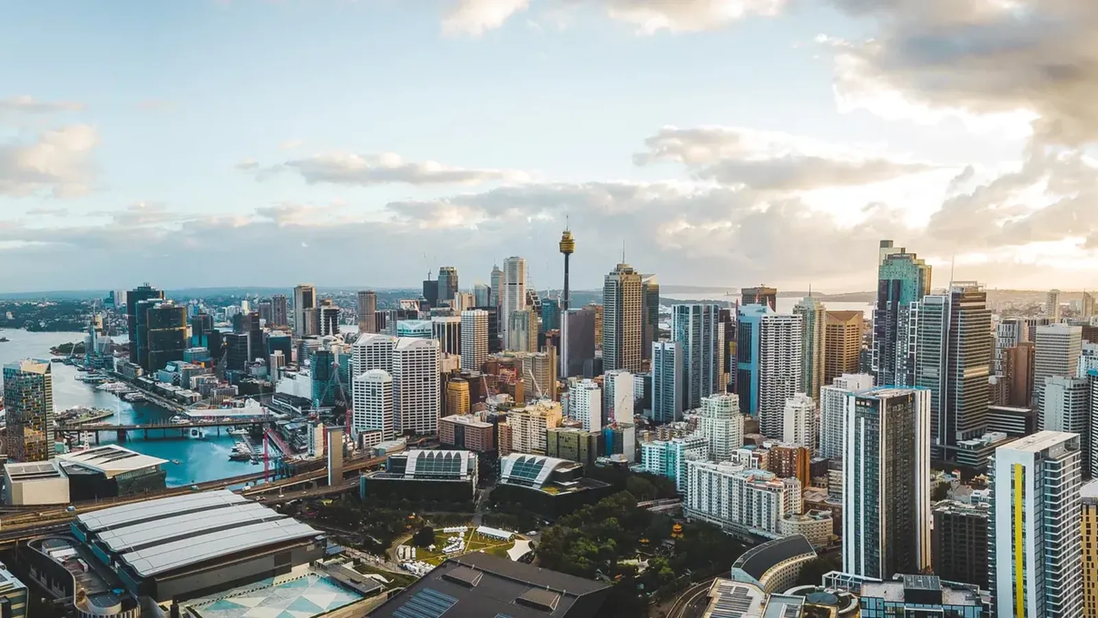 Aerial view of the Sydney CBD skyline and Darling Harbour at golden hour before an interstate move